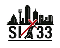 a man walking with a cross in front of a city skyline